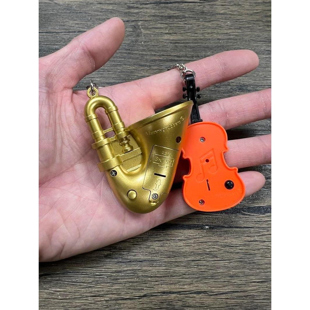 Llavero Juguete MunnyGrubbers Violín y Trompeta Triste