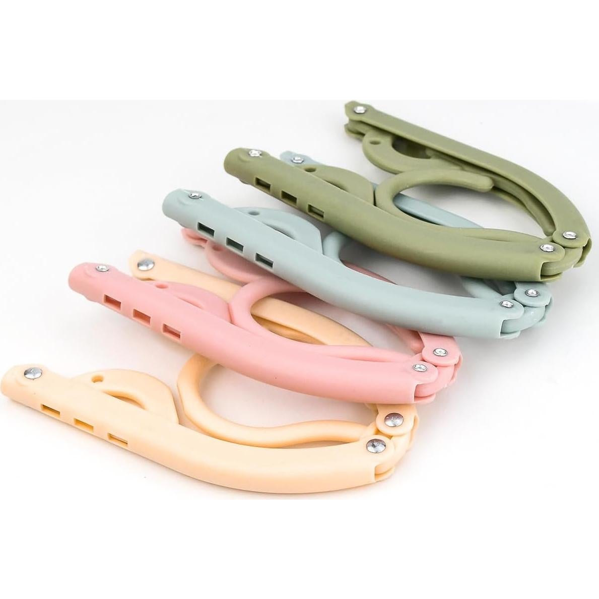 12 Perchas Plegables Bilkeru de Plástico para Viaje - 4 Colores