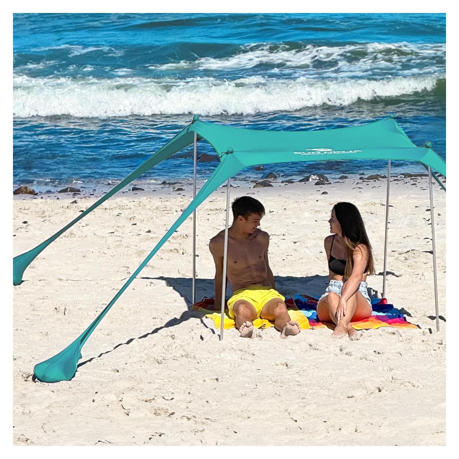 SUN NINJA Beach Tent Sun Shelter UPF50+ - Easy Pop Up Beach Canopy - Outdoor Shade for Camping Trips, Fishing, Backyard Fun Picnics - Sand Shovel, Ground Pegs & Stability Poles