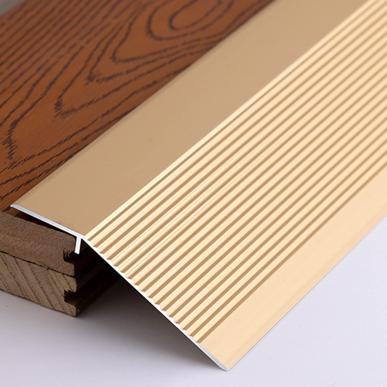 Tira de transición de suelo Dntum 90cm dorada aluminio