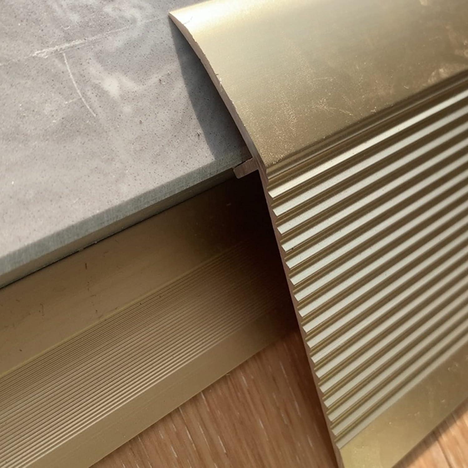 Tira de transición de suelo Dntum 90cm dorada aluminio