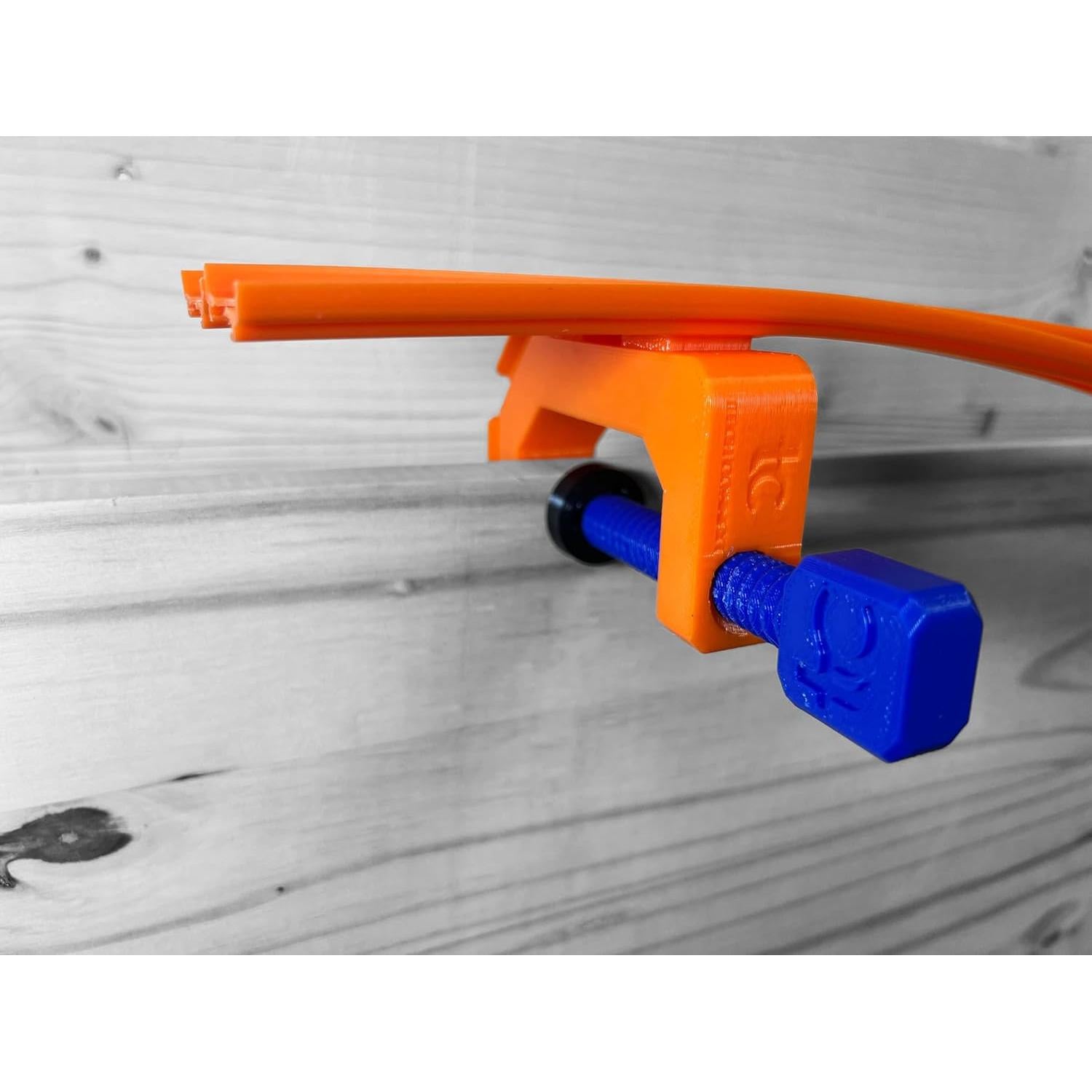 Abrazadera de Pista Hot Wheels Azul/Naranja - Fuerte y Duradera