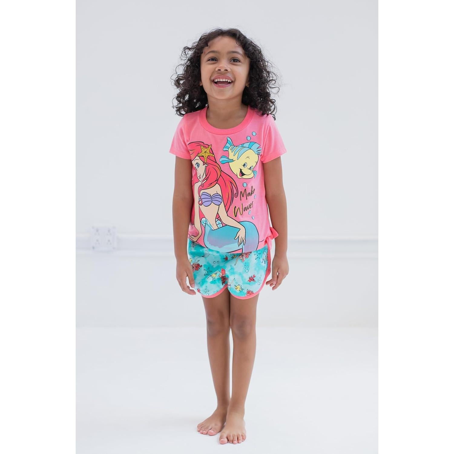 Conjunto camiseta peplum floral Disney + pantalones cortos 18M