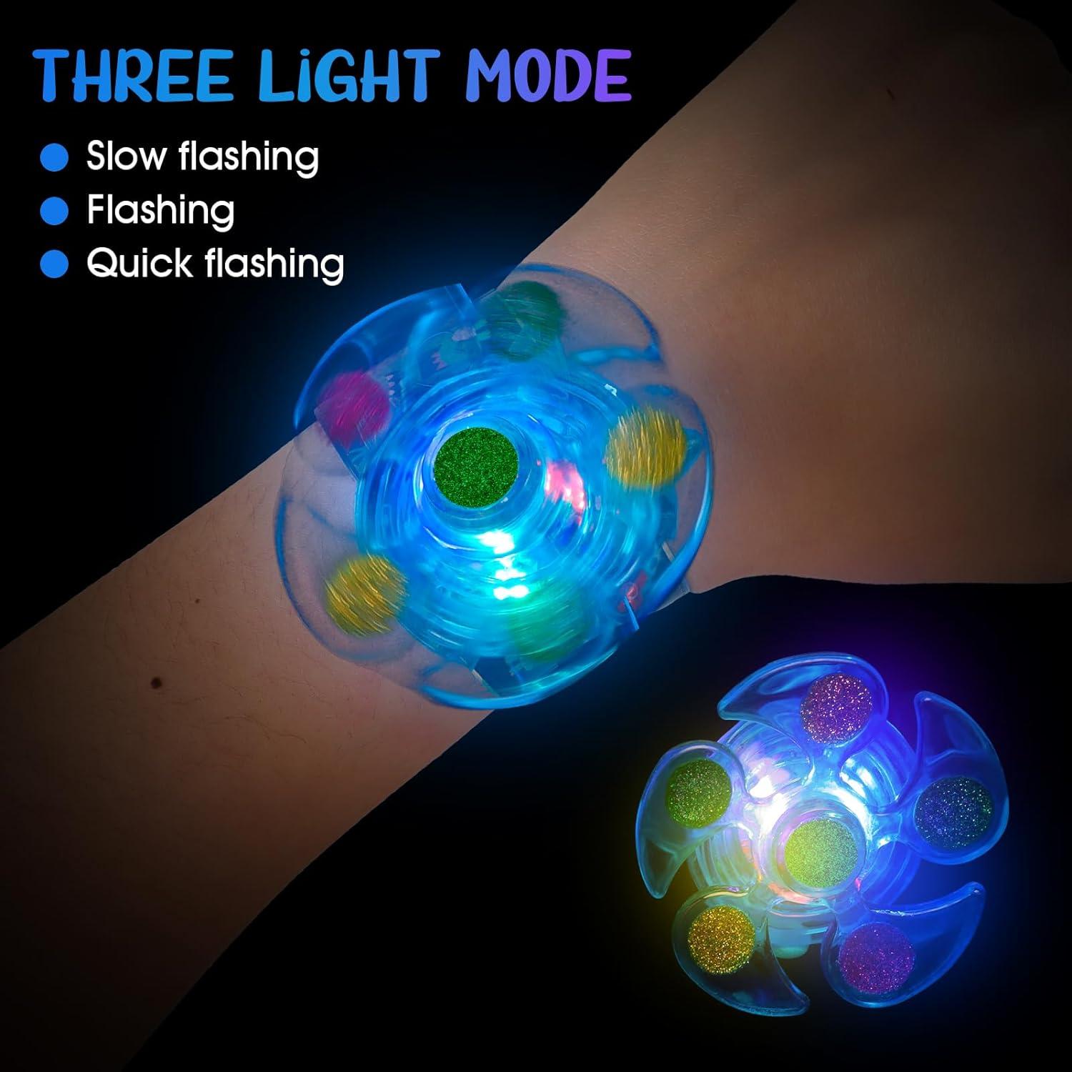 Juguete Giratorio Iluminado + 25 Pulseras Dinosaurio Efun