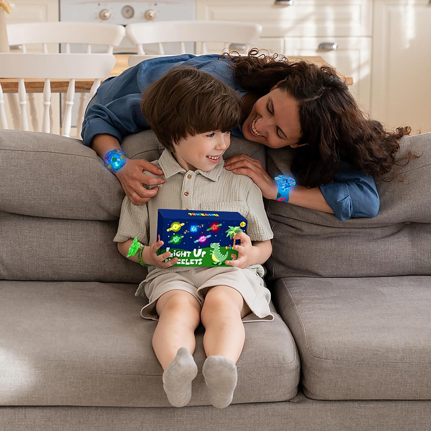 Juguete Giratorio Iluminado + 25 Pulseras Dinosaurio Efun