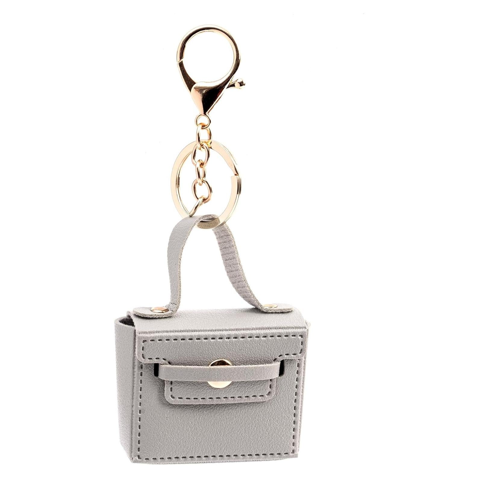 Llavero de bolso mini de cuero PU gris con charms para mujer