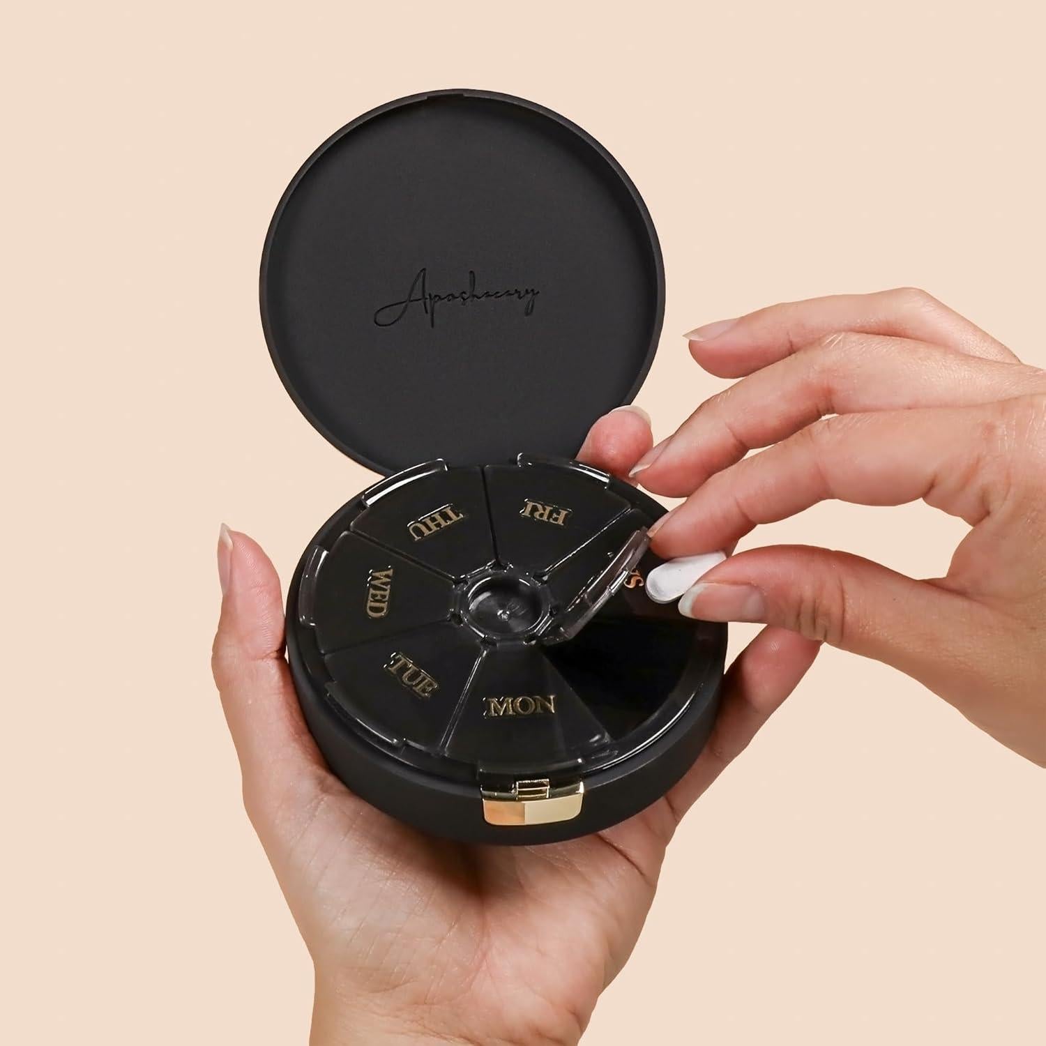 Estuche organizador de pastillas Aposhacary 7 compartimentos negro