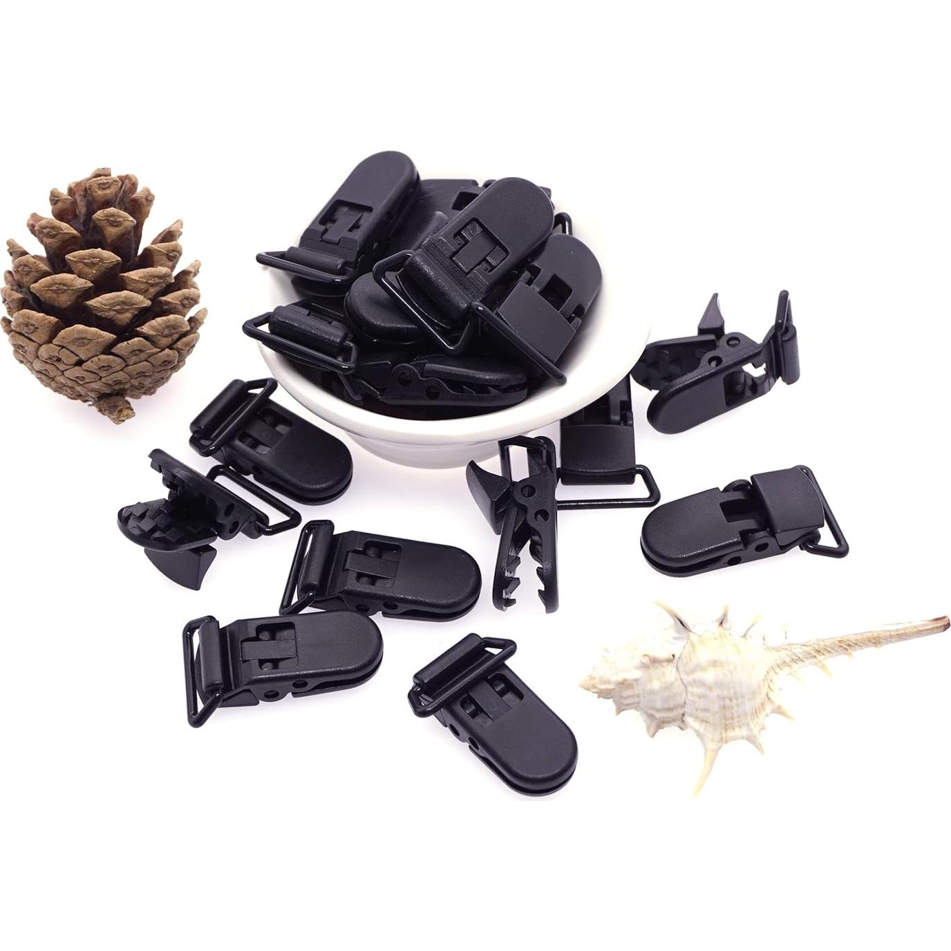 25 Clips de Chupete Plástico Negro Sutoyuen para Bebés