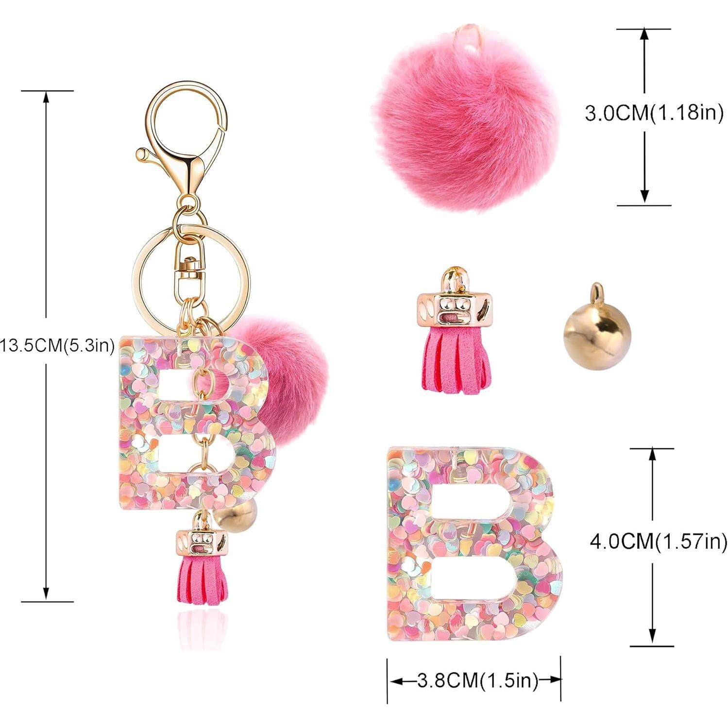 Llave de letra B de resina con bola de pelo rosa profundo