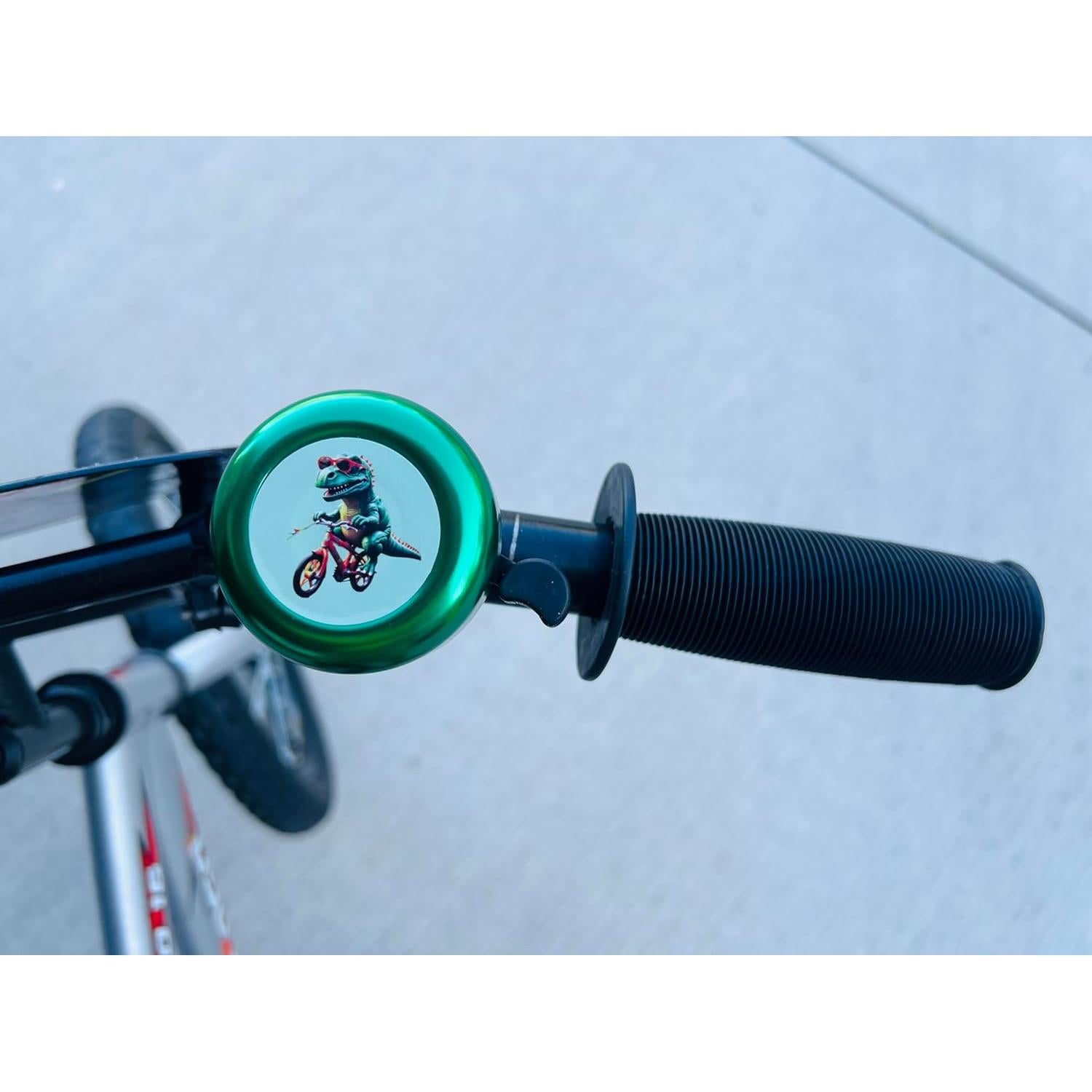 Timbre de Bicicleta para Niños Genérico - Diseño Dinosaurio Verde y Azul