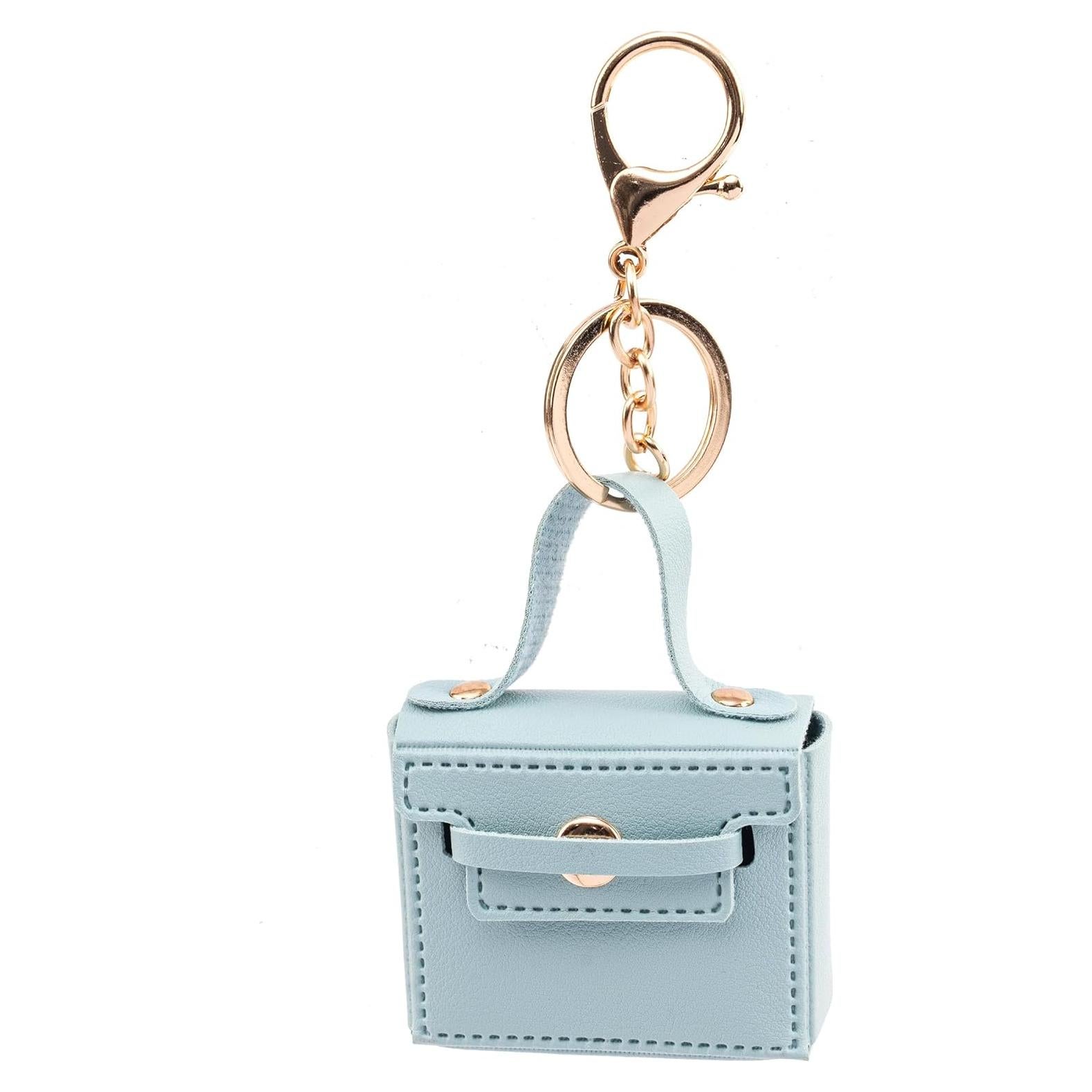 Llavero de bolso mini de cuero PU azul con charms para mujer