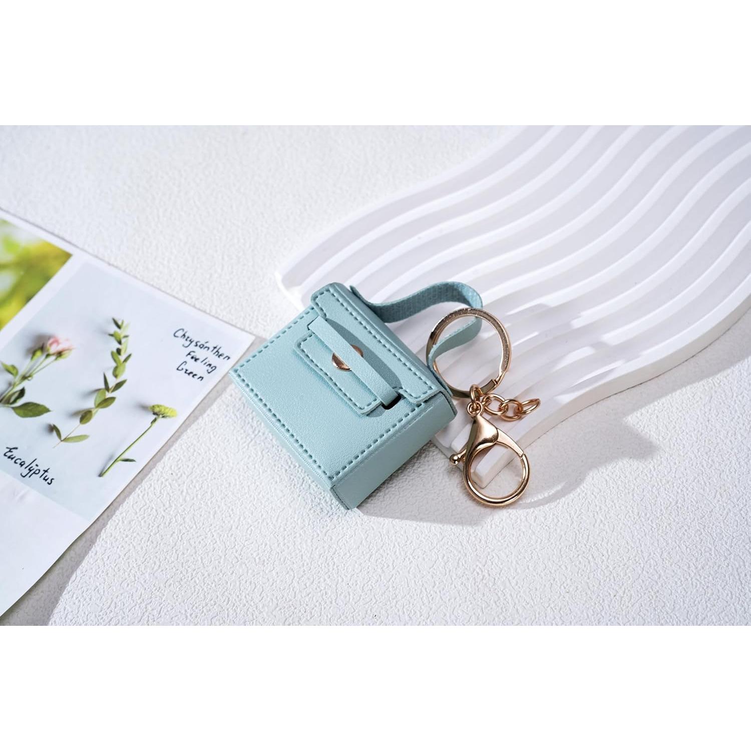 Llavero de bolso mini de cuero PU azul con charms para mujer