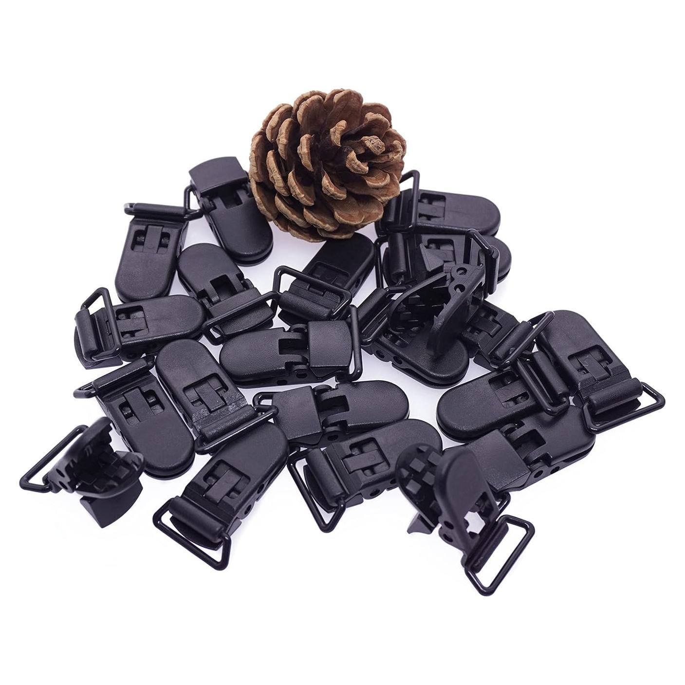 25 Clips de Chupete Plástico Negro Sutoyuen para Bebés