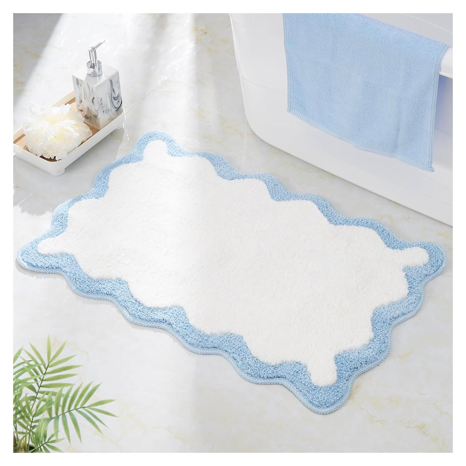 Alfombra de baño DyeFury azul con borde en forma de concha 76x51cm