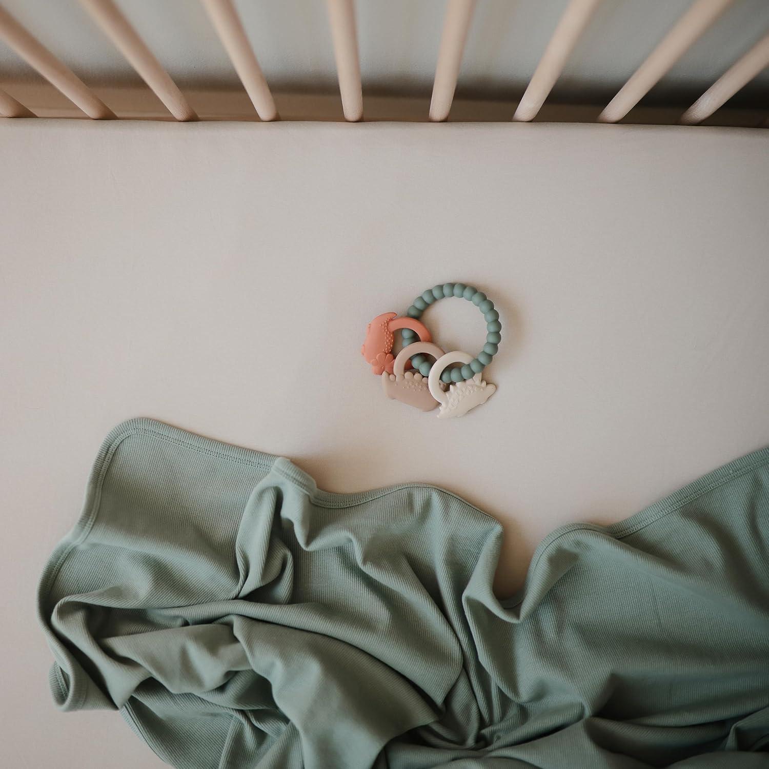 Anillo de Dentición Mushie Dino de Silicona 100% Seguro