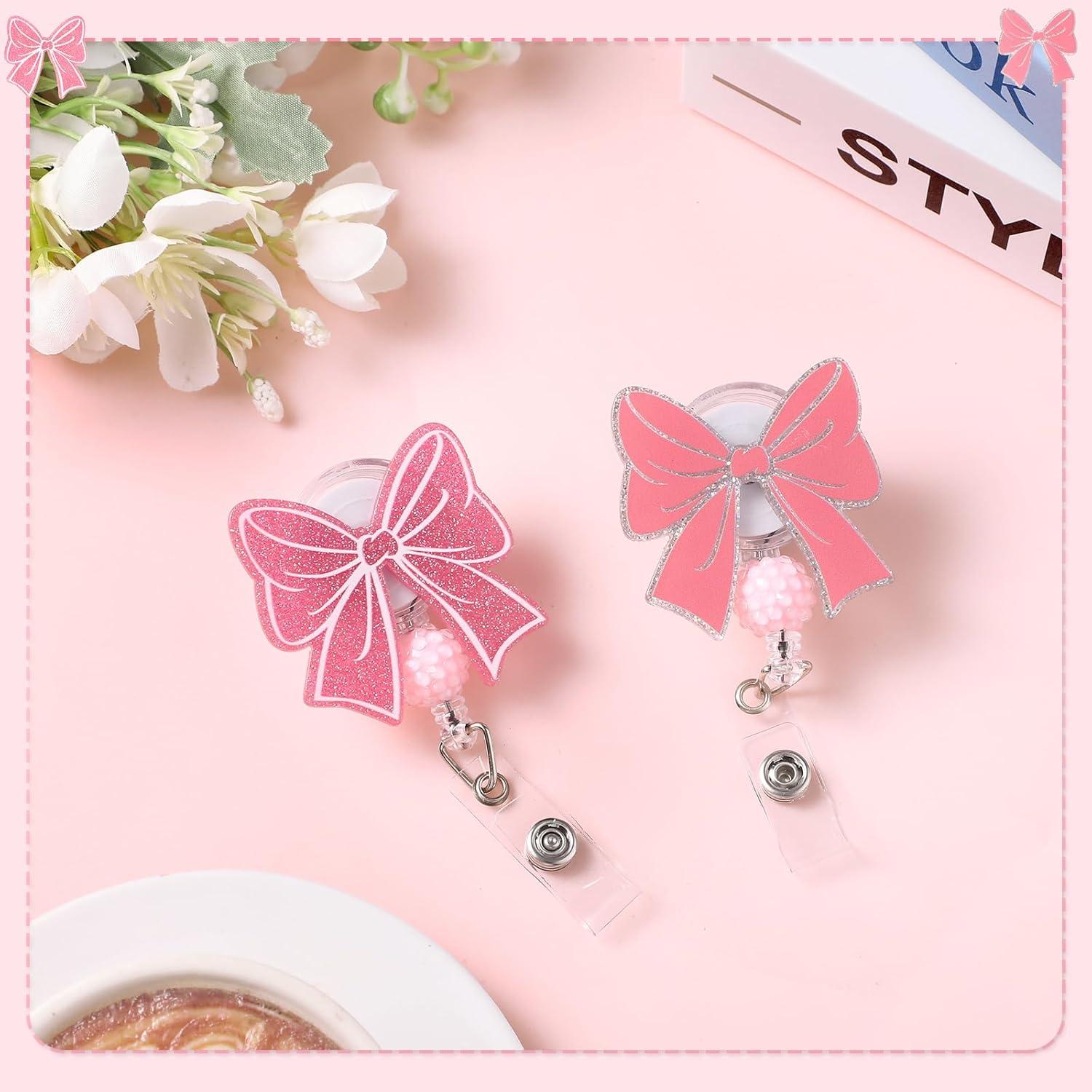 2 Ruedas de Insignia Retráctiles BESARME Lazo Rosa Clip