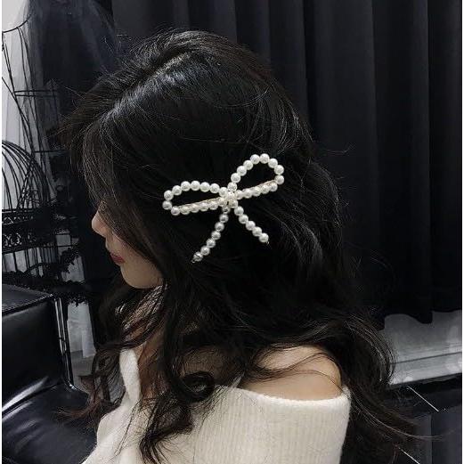 Clip de Pato Elegante Pluzmecalm con Lazo de Perla Blanca