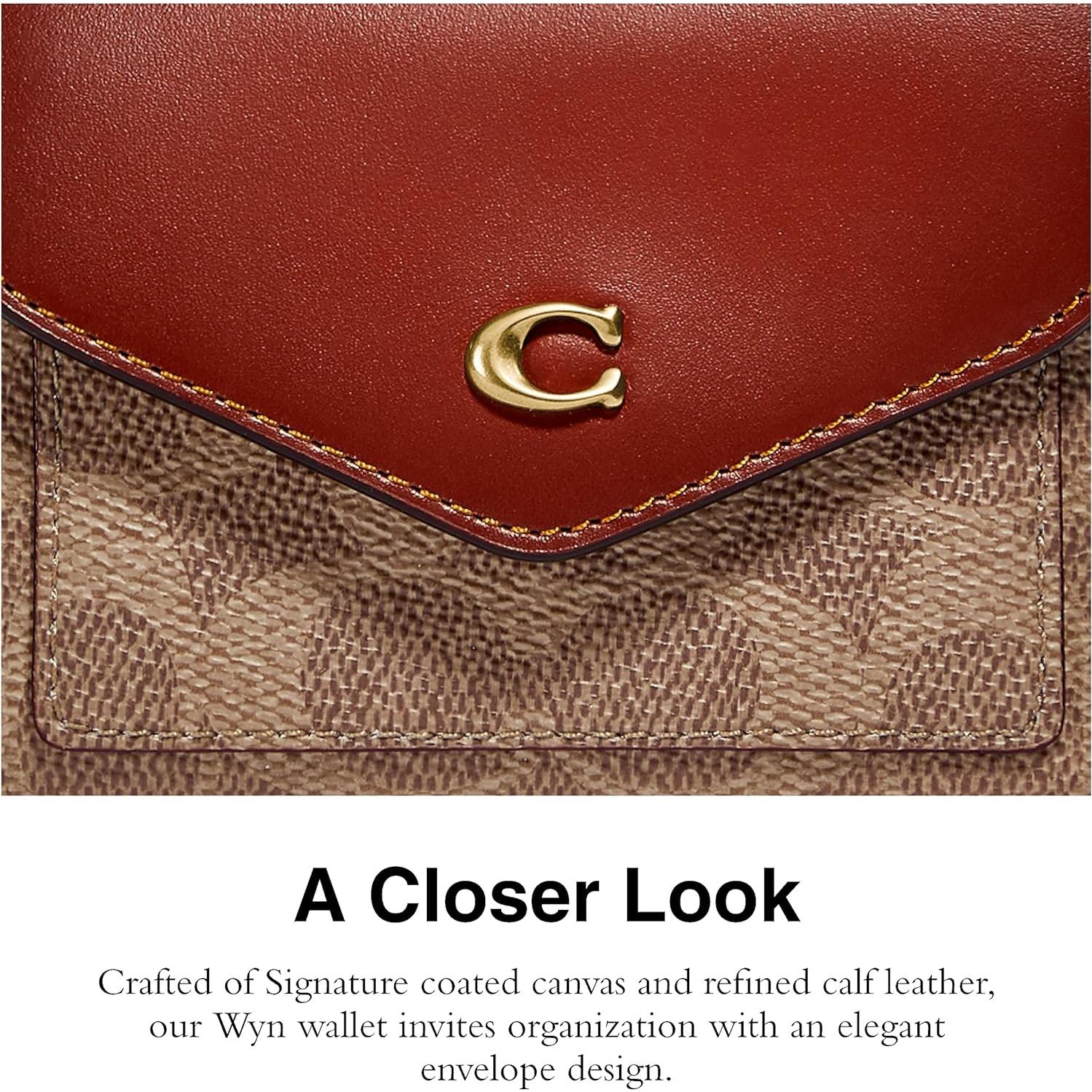 Billetera Coach Wyn de lona recubierta con 7 ranuras