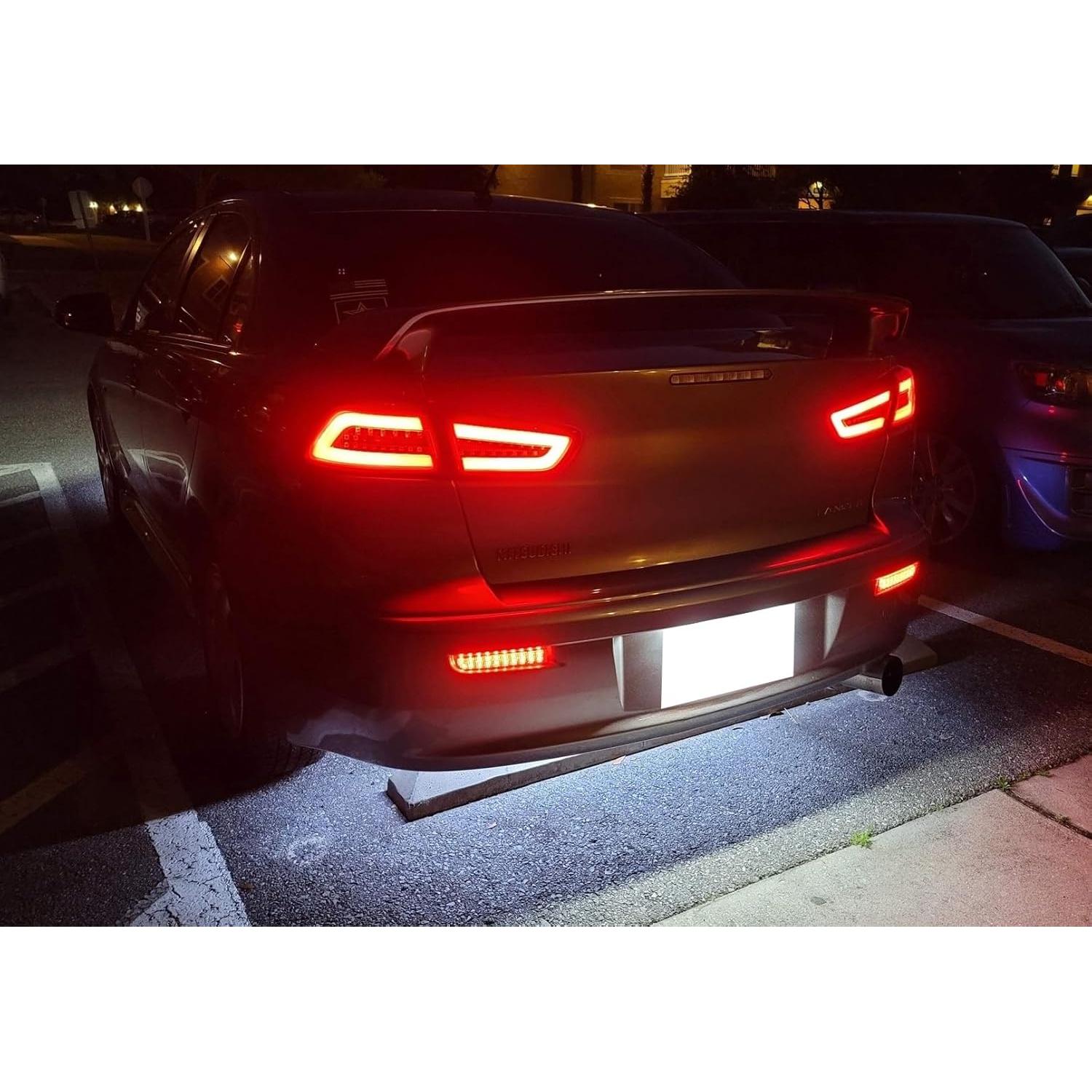 Luces Reflectoras LED Parachoques iJDMTOY Ahumadas para Mitsubishi