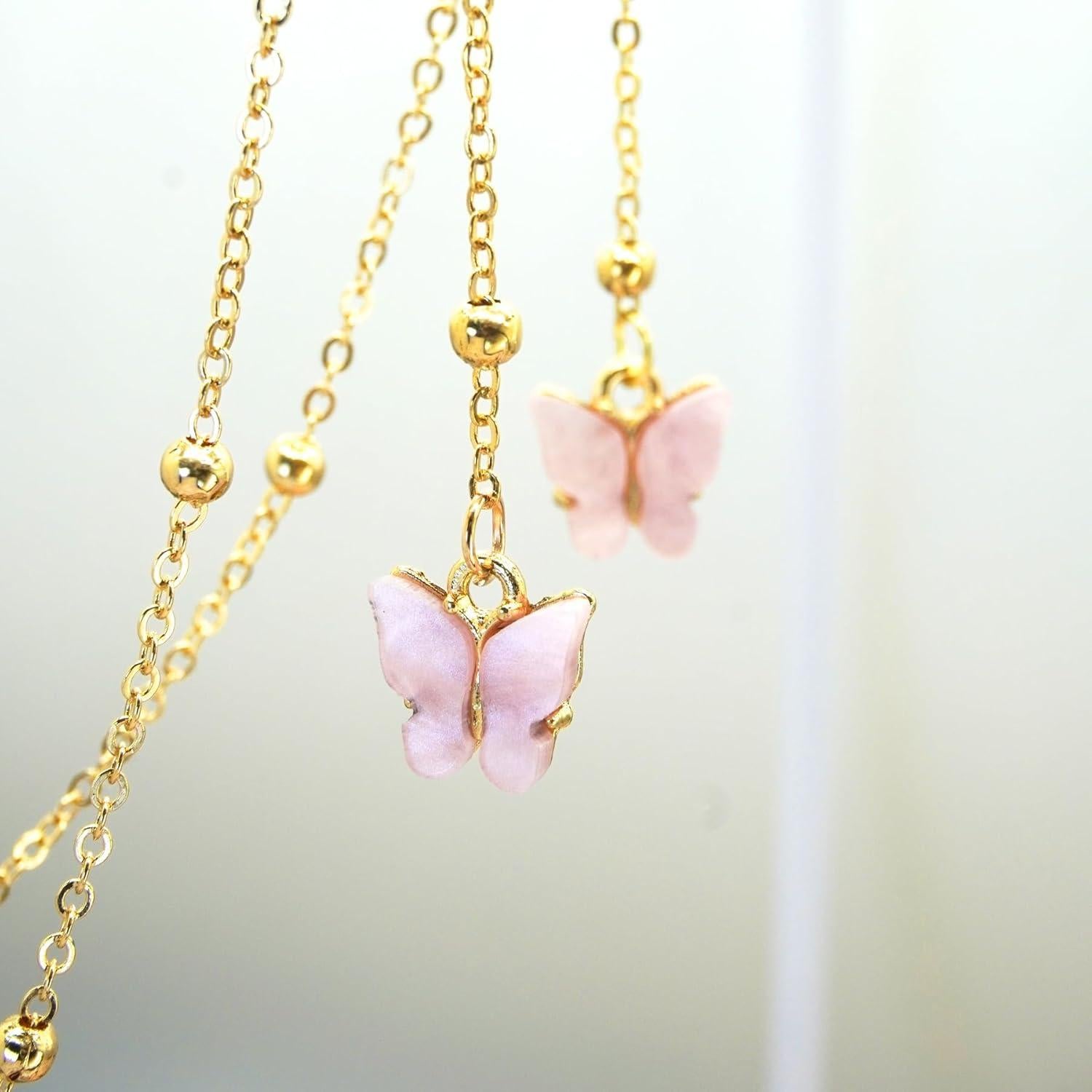 Cadena de Gafas Rosa con Mariposa y Perlas Doradas