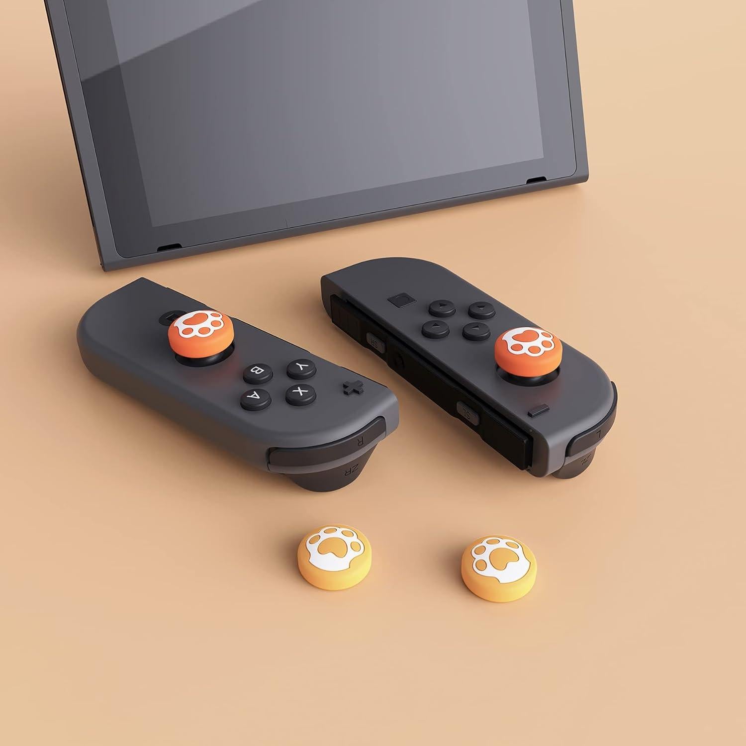 Tapa de Joystick eXtremeRate para Nintendo Switch Lite - Silicona Amarillo y Naranja