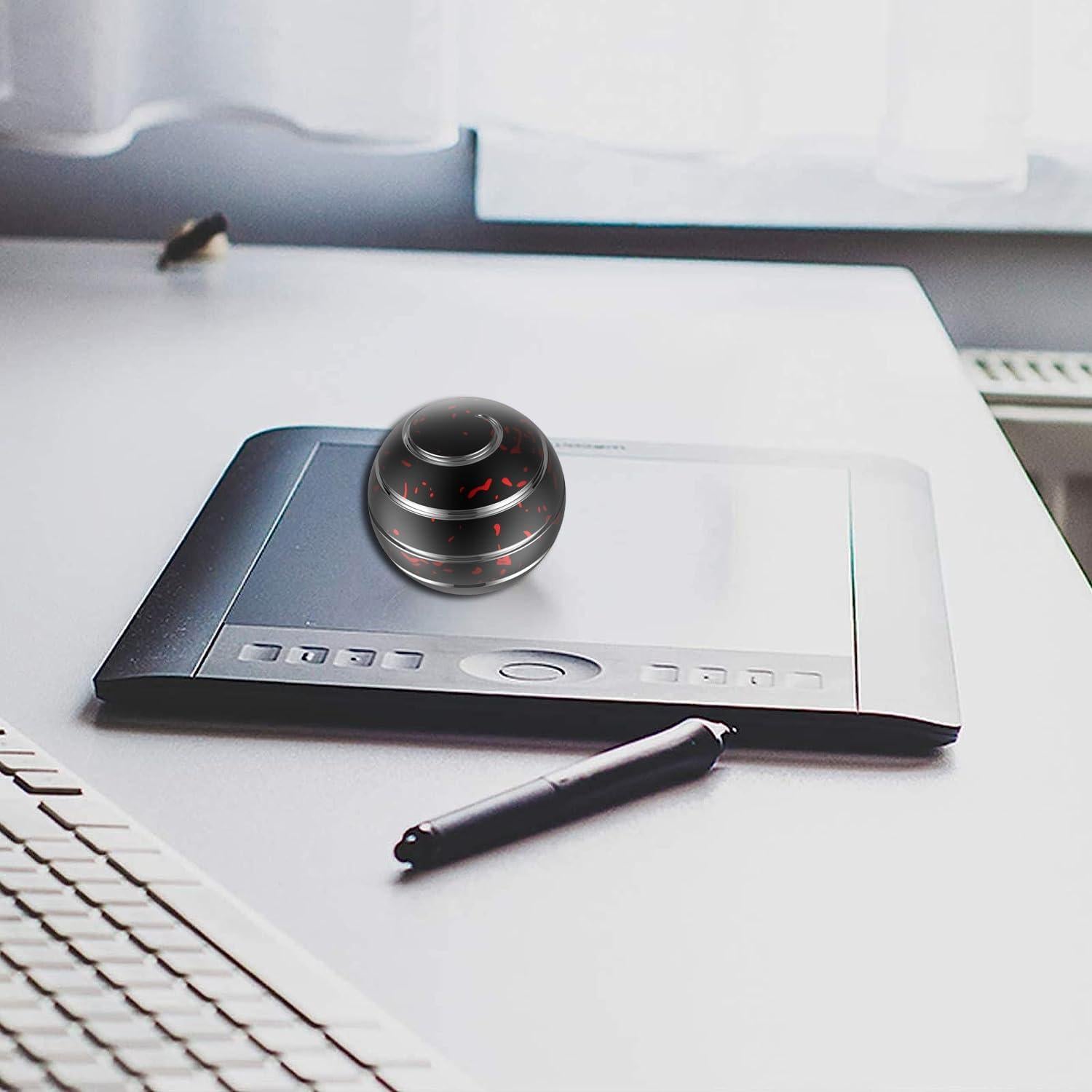 Juguete Antiestrés Kinetic Amber 39mm Negro Rojo